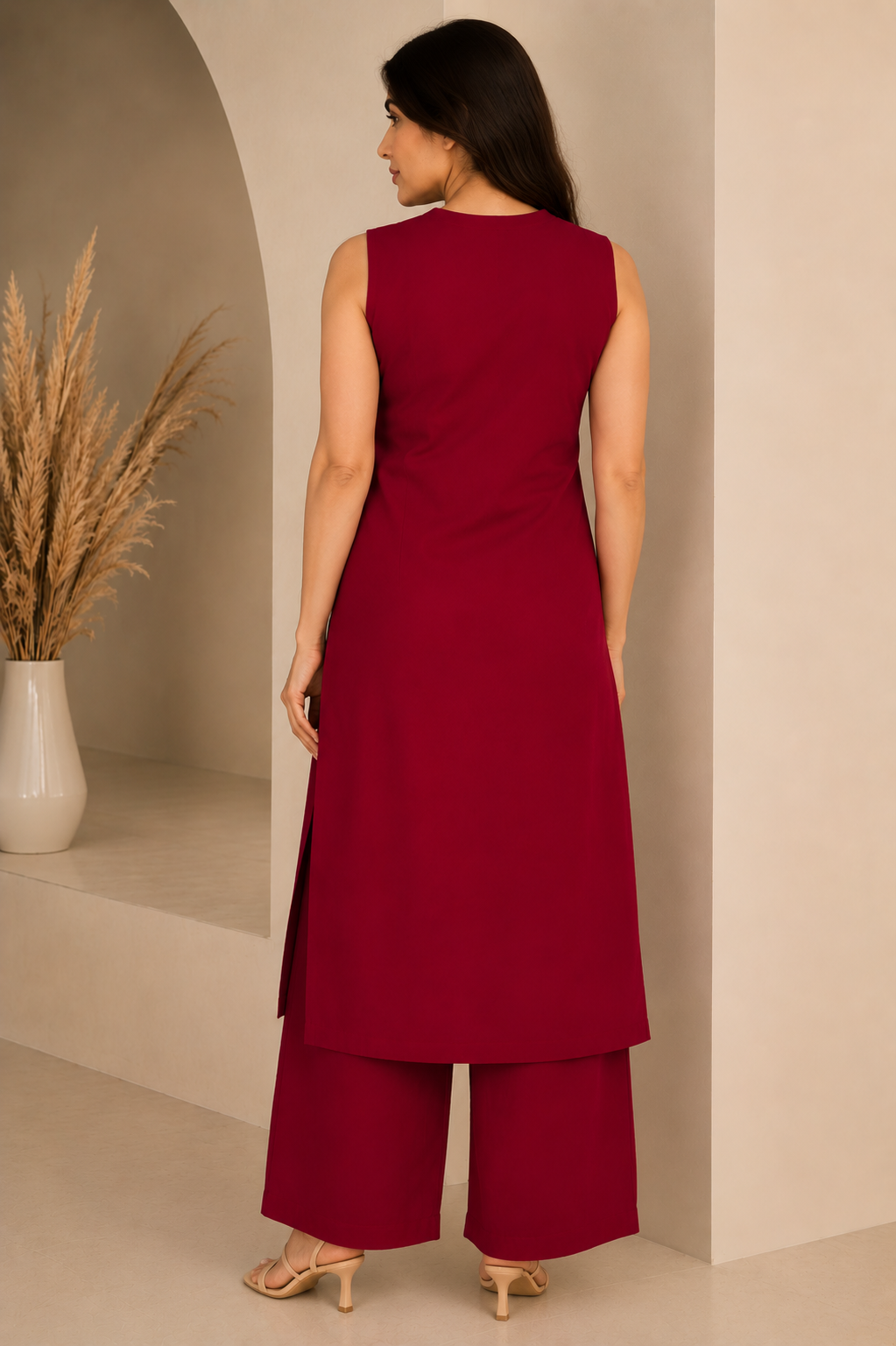 Maroon solid A-line sleeveless kurta paired with matching palazzo